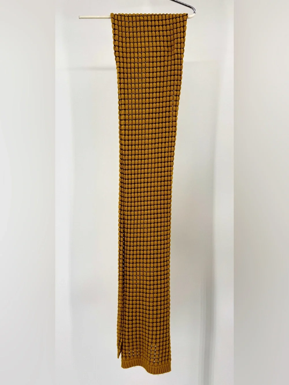 Extra long knit scarf in mustard yellow.
